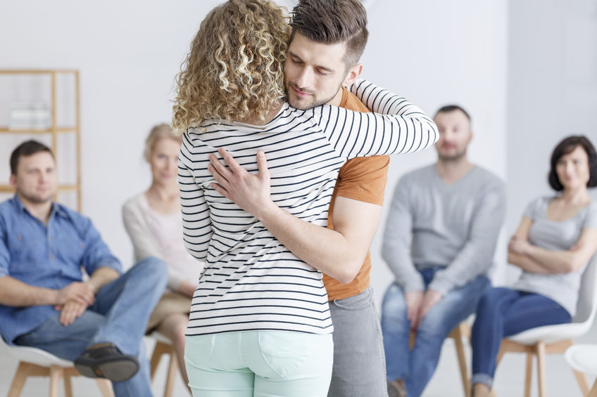 couple hugging during christian marriage counseling process